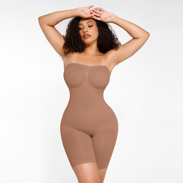 Woman wearing a beige shapewear bodysuit on a white background