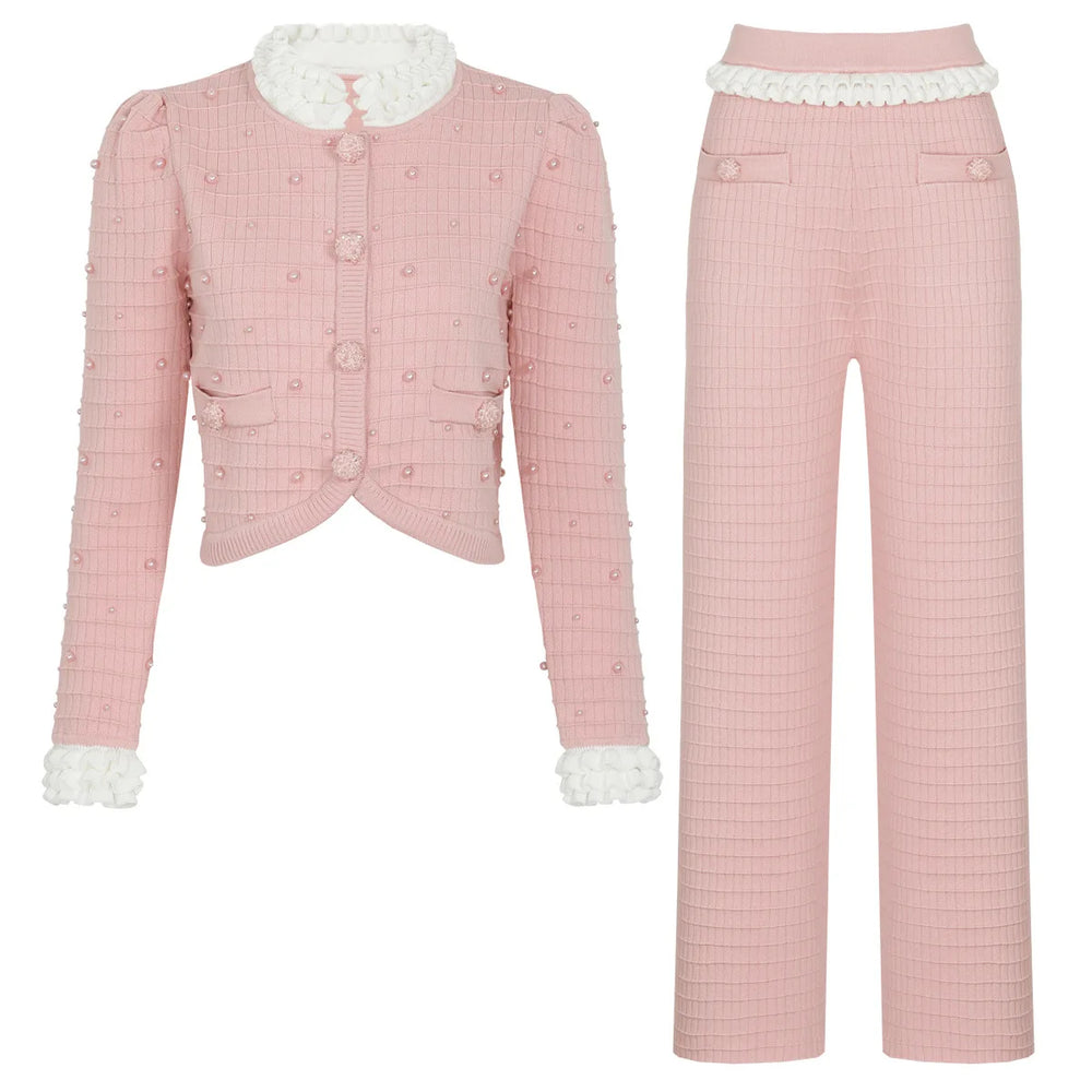 Pink checkered outfit with white lace details on a white background