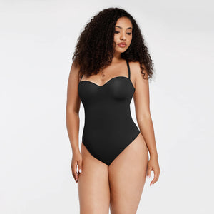 Woman wearing a black strapless swimsuit on a white background