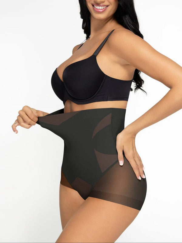 Woman wearing a black bra and shapewear on a white background